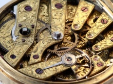 SKU IB03775: close-up of a richly engraved gold pocket watch movement with visible gears and screws.