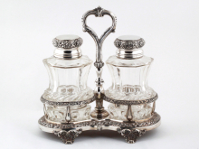 IB08134, Josef Carl Klinkosch sterling silver cruet with two cut crystal bottles and ornate handle stand.