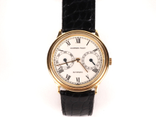 Audemars Piguet Classic Day Date wristwatch, SKU IB09473, with gold case, white Roman numeral dial, day and date subdials, and black crocodile strap.