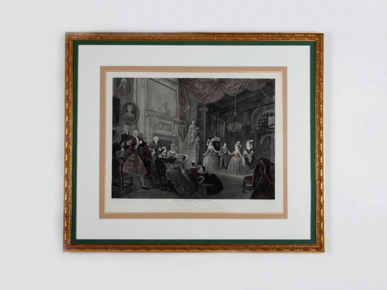 SKU IB00338: Framed engraving of a theater scene from John Dryden’s The Indian Emperor, shown in a gilded wooden frame.