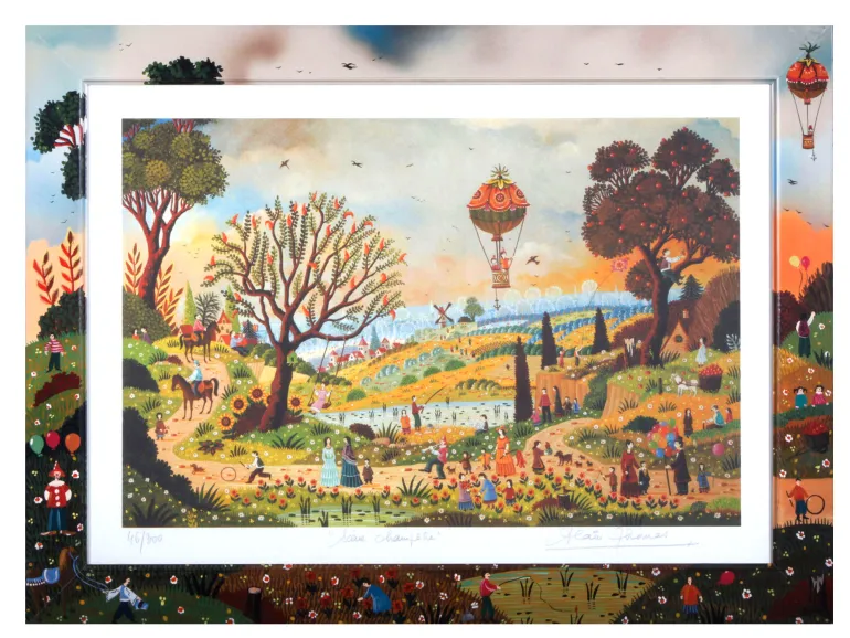 Lithographie d’Alain Thomas "Scène Champêtre" IB02571, numérotée 46/300, montrant une scène champêtre colorée avec arbres, personnages, animaux et montgolfière dans un cadre en bois peint.