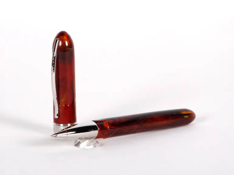 Stylo roller Visconti Van Gogh orange marbré, SKU IB02654, avec garniture argentée sur fond blanc.
