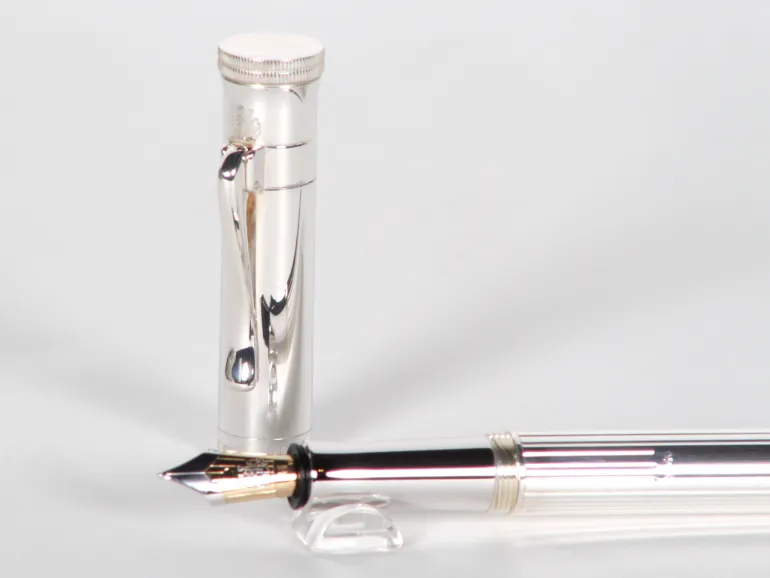 Faber-Castell sterling silver fountain pen, SKU IB02982, shown with cap and nib visible on a white background.