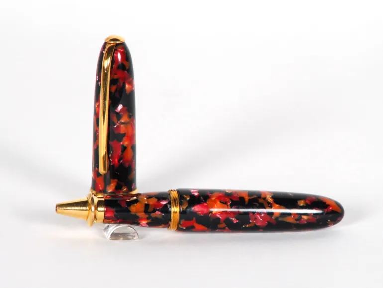 Jean Pierre Lepine Churchill roller pen, SKU IB02996, turtle-shell red and black finish with gold trim, shown open and horizontal.