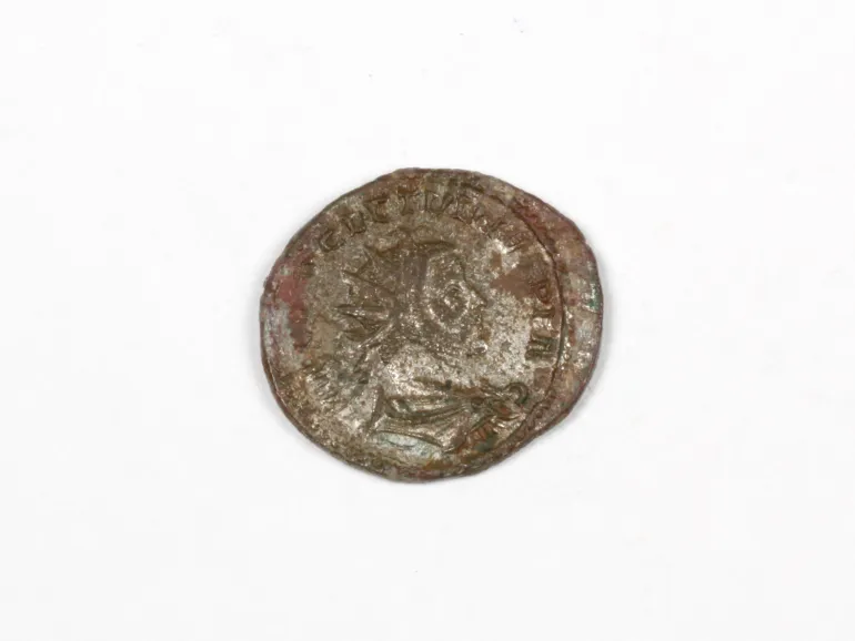 IB03317 Roman silver coin of Diocletian, worn coin with Jupiter on the reverse, shown on a white background.