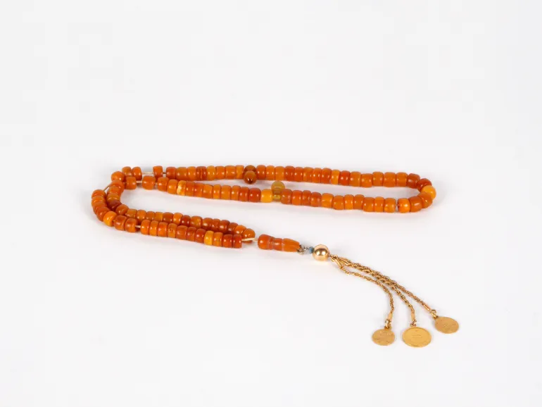 Masbaha rosary in old Indian amber with silver pendant and gold-toned tassels, SKU IB03644.