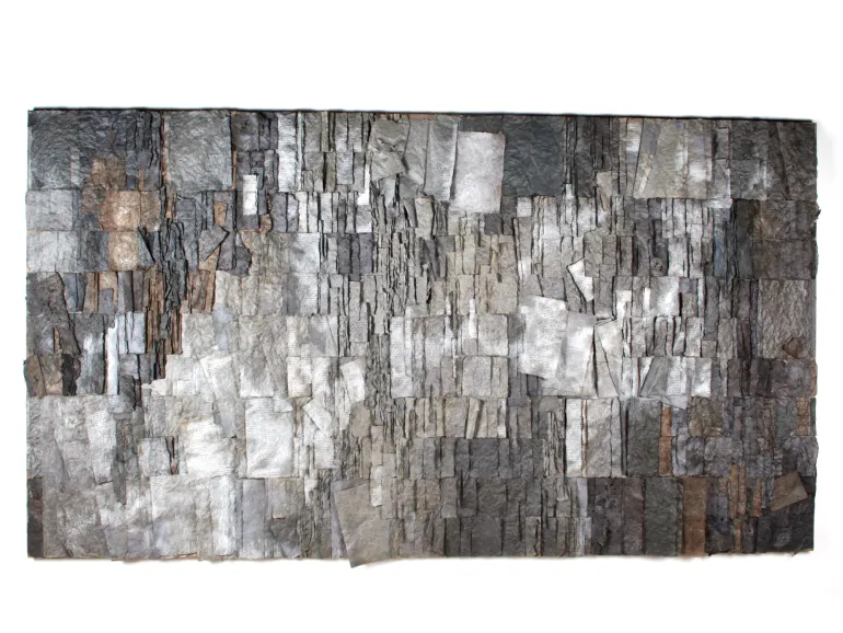 Claudie Hunzinger, IB07213: mixed-media artwork of layered ash-gray paper and parchment fragments forming a textured abstract composition.