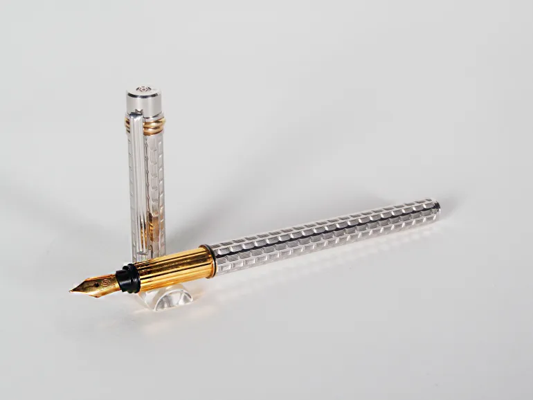 Cartier Trinity 3 fountain pen, SKU IB07755, shown with silver guilloché body, gold-plated trim, and 18k nib.