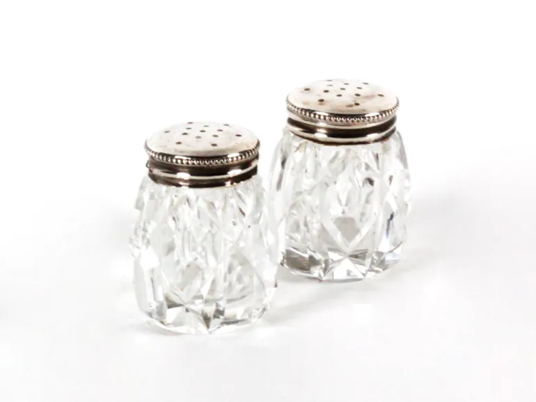 SKU IB08245: pair of cut crystal salt and pepper shakers with sterling silver tops, shown on white background.