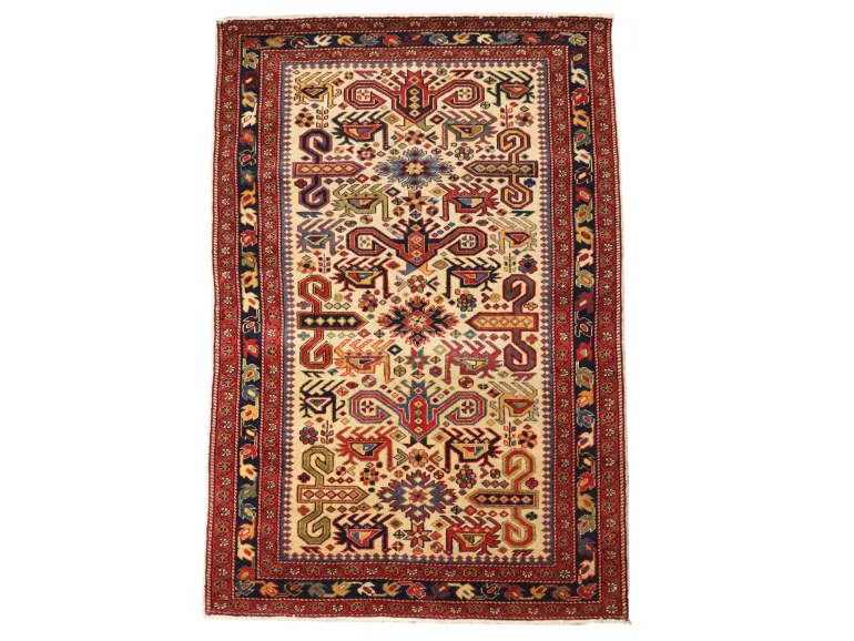 Caucasian Chirvan Kuba Perpedil wool rug, SKU IB09734, with geometric, animal and floral motifs in red, cream and blue.