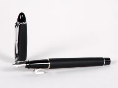 Aurora Ipsilon fountain pen, graphite color, shown with cap and nib visible, SKU IB02877.