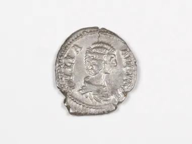 SKU IB03485: Roman silver denier coin of Julia Domna, worn portrait visible on a silver-toned coin.