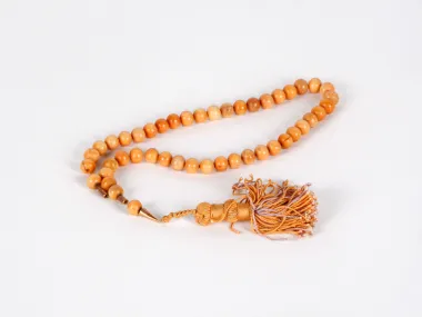 Antique bone rosary with 46 round carved beads and braided tassel, IB03633