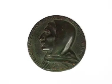 IB03965 patinated bronze round medal showing a profile head in green patina with Latin inscription.