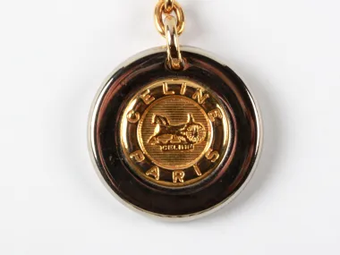 Celine key chain, SKU IB08961, round gold-tone and silver-plated medallion with engraved logo.