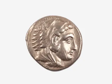 IB08972: Silver Greek tetradrachm coin showing the head of Alexander III in profile.