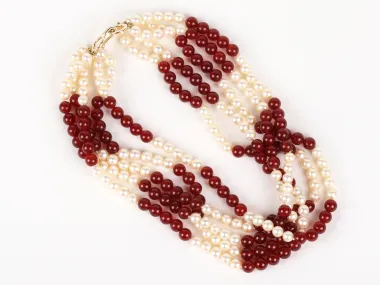 Pearls and carnelian necklace, IB09270, with five rows of cream pearls and red beads, shown with a gold clasp on a white background.