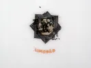 Limoges Porcelain IB00077 mark with Art Deco star emblem and the word “Limoges” below.