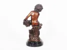 IB00733, Auguste Moreau bronze sculpture of a young boy holding a basket, shown on a black marble pedestal.