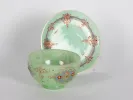 Green opaline glass bowl and plate, IB00833, with painted Islamic-style decoration shown on a stand.
