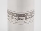 Silver plated cylindrical shaker, IB01083, with guilloché band and cat motif.