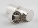 Silver plated cylindrical shaker, IB01083, with guilloché cat border and open end shown.
