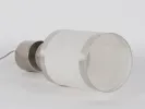 IB01200 chrome steel lamp base with original shade, shown on its side; brushed metal with two cylindrical sections.