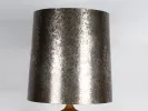 SKU IB01916: close-up of a large silver-toned lamp shade on a 1960s ceramic lamp base.