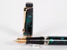 Aurora Optima fountain pen, emerald green and black with gold trim and gold nib, SKU IB02690.