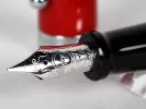 Aurora IB02701 Talentum fountain pen with red lacquer body and chrome 14K nib shown in close-up.