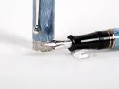 Aurora Saint Petersburg fountain pen, SKU IB02743, shown with blue guilloché barrel and silver nib on a white background.