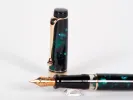 Aurora Optima fountain pen, SKU IB02808, with emerald green marbled barrel, gold trim, and gold nib shown on white background.