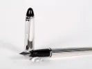 Aurora Ipsilon sterling silver fountain pen, SKU IB02844, shown with black cap and silver striped barrel.