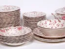 Johnson Brothers IB05010 English Rose Chintz table set with stacked floral plates, bowls and serving pieces.