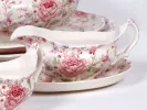 Johnson Brothers IB05010 English Rose Chintz gravy boat and matching dish, white earthenware with pink floral pattern.