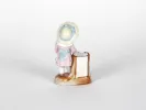 IB05065: small painted porcelain sculpture of a girl in a pink dress with a basket, shown from the back.