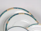 Villeroy & Boch IB05444 Villa Magica white porcelain plates with blue, gold, green and brick frieze detail.
