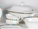 Villeroy & Boch Villa Magica table set, SKU IB05444, white porcelain pieces with blue, brick, green and gold frieze; visible tureen, sauceboat and bowls.