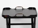 Hanbel IB05630 low folding wooden tray table with dark finish and metal handles, shown on foldable stand.