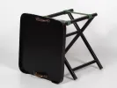 Hanbel IB05630 wood low folding table with dark tray top, brass handles, green fabric straps, and folded black wooden stand.