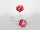 Pair of red crystal Rhin glasses, SKU IB06176, shown with one upright and one lying on its side.