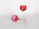IB06176 pair of red crystal Rhin glasses with etched cut pattern, one upright and one lying on its side.