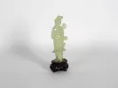 Serpentine geisha sculpture on carved wooden plinth, SKU IB06292.