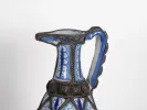 SKU IB06326: Blue ceramic Moroccan jug with one handle and silver filigree, shown close up on a white background.