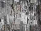 Claudie Hunzinger, IB07213: grey mixed-media artwork with layered ash-like paper and parchment textures.