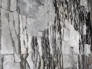 Claudie Hunzinger, IB07213: close-up of a grey mixed-media artwork with layered ash-like paper and faint text.