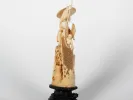 IB07522 Japanese Meiji-period ivory okimono of a fisherman with net, carved on a wooden base.