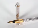 Cartier Trinity 3 fountain pen, SKU IB07755, shown with silver and gold-plated ribbed body and 18k nib.