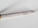 Cartier Trinity 3 fountain pen, SKU IB07755, silver guilloché body with gold trim, shown close-up on white background.