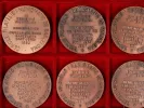SKU IB07763 : six médailles en bronze de Saint Georges dans un écrin rouge de présentation, avec inscriptions gravées visibles.